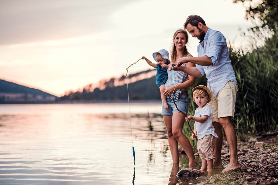 Client Center - Small Family Fishing at the Lake at Sunset