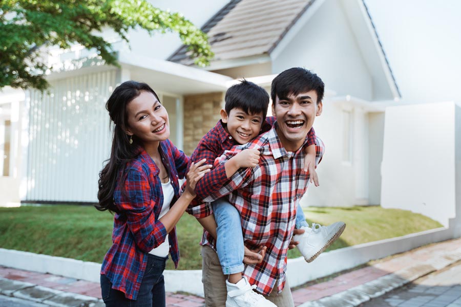 Personal Insurance - Family Standing in Front of Their Home in North Carolina